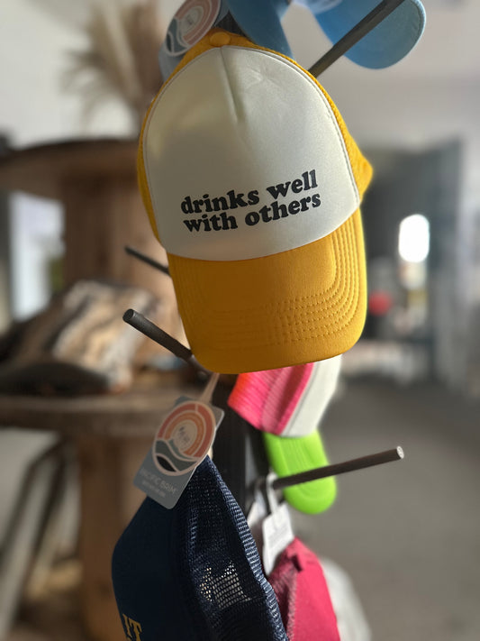 Hat- drinks well with others