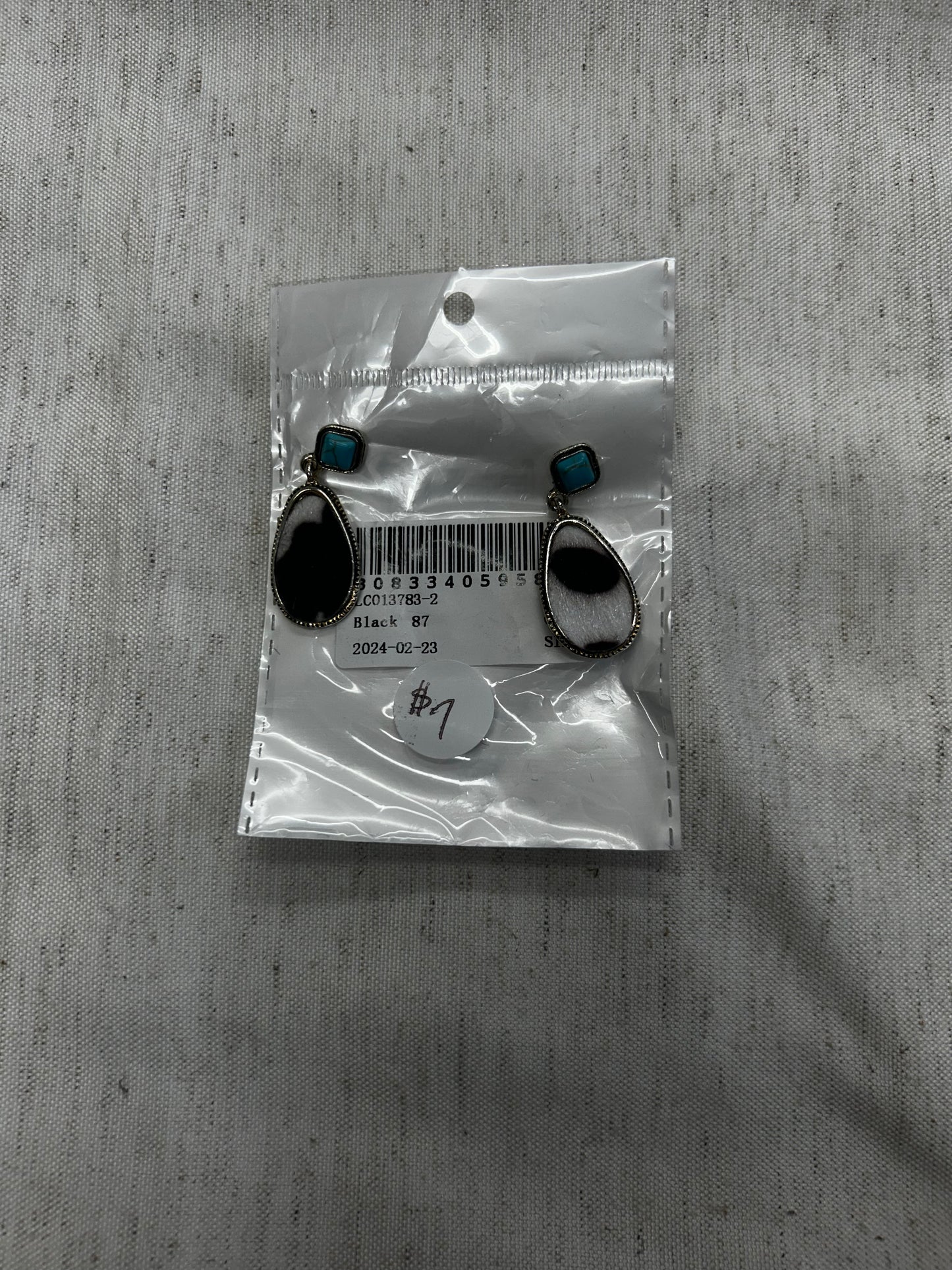 Black and white cow print and turquoise earrings